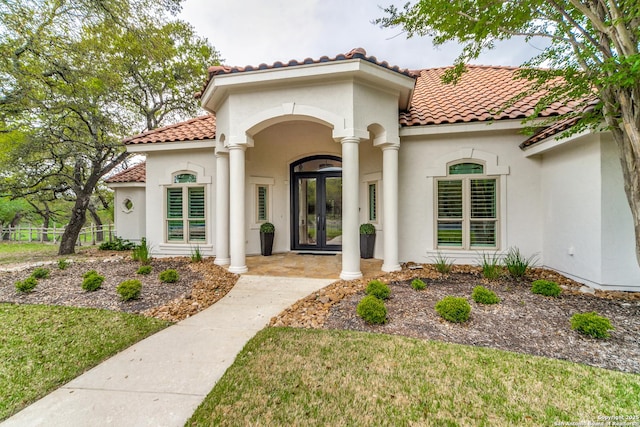 property entrance featuring french doors