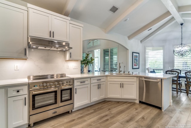 kitchen with sink, stainless steel appliances, white cabinetry, and light wood-type flooring