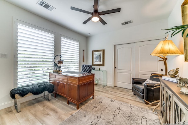 office space featuring light wood-type flooring and ceiling fan