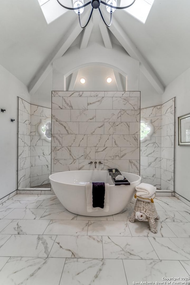 bathroom featuring tile walls, lofted ceiling with beams, an inviting chandelier, and separate shower and tub