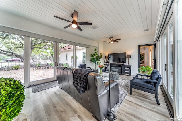 living room with ceiling fan, light hardwood / wood-style floors, and wood ceiling