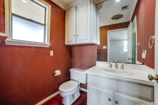 bathroom featuring crown molding, vanity, and toilet