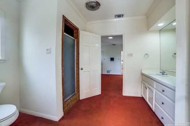 bathroom featuring toilet, an enclosed shower, vanity, and crown molding