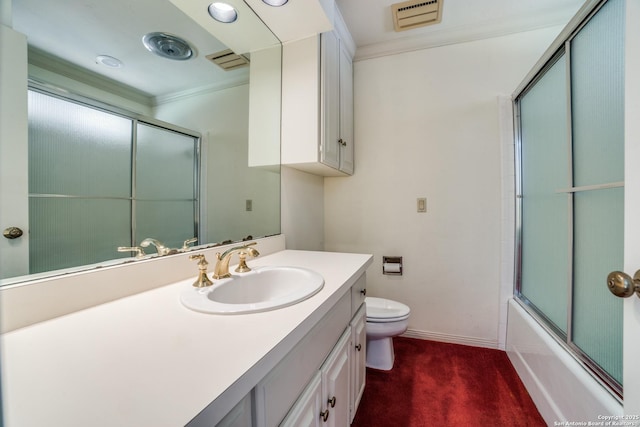 full bathroom featuring toilet, vanity, enclosed tub / shower combo, and ornamental molding