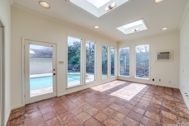 unfurnished sunroom featuring an AC wall unit and a skylight