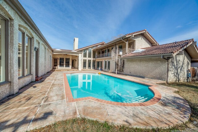 view of pool featuring a patio area