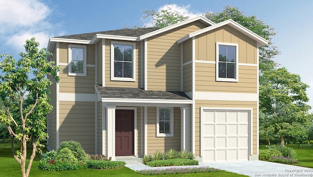 view of front of house with a front yard and a garage