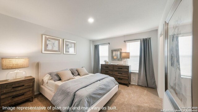 bedroom with light colored carpet