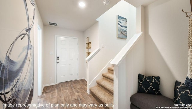 entryway with hardwood / wood-style flooring