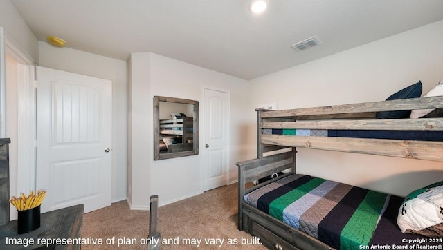 bedroom featuring light carpet