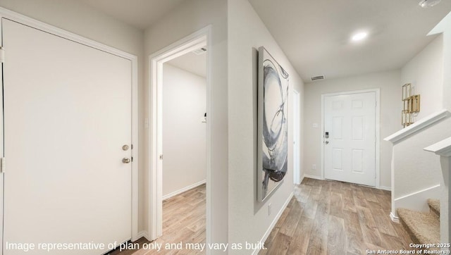 washroom with light hardwood / wood-style floors