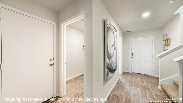 washroom with light hardwood / wood-style floors