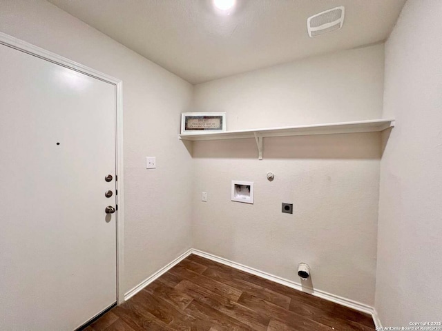 clothes washing area featuring dark wood-type flooring, hookup for an electric dryer, hookup for a gas dryer, and washer hookup