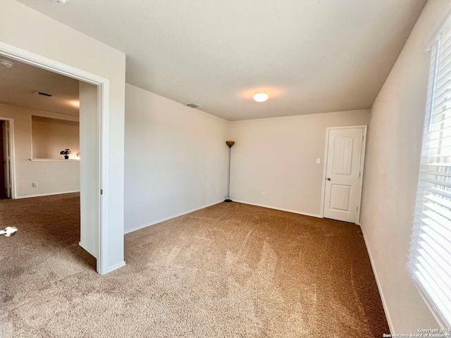 spare room with carpet floors