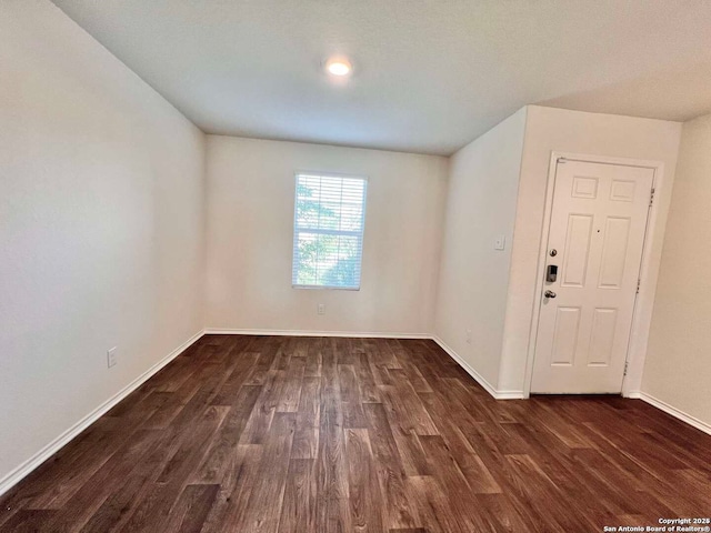 empty room featuring dark hardwood / wood-style floors