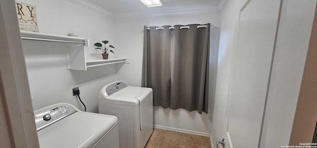 clothes washing area featuring washer and dryer, ornamental molding, and light tile patterned floors