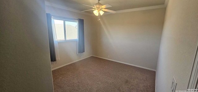 empty room featuring ornamental molding, ceiling fan, and dark colored carpet