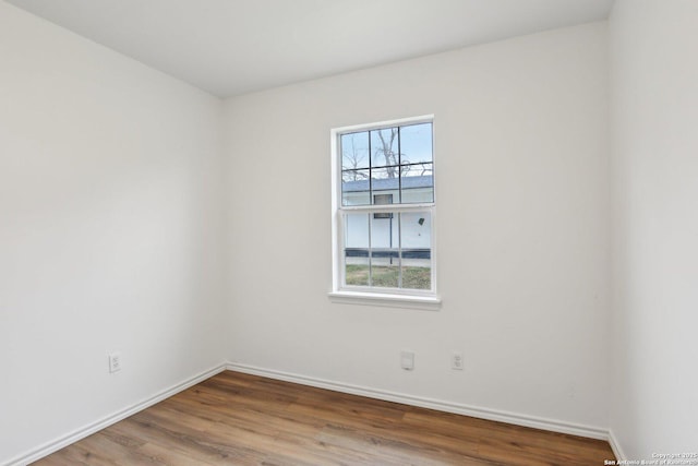 empty room featuring wood-type flooring