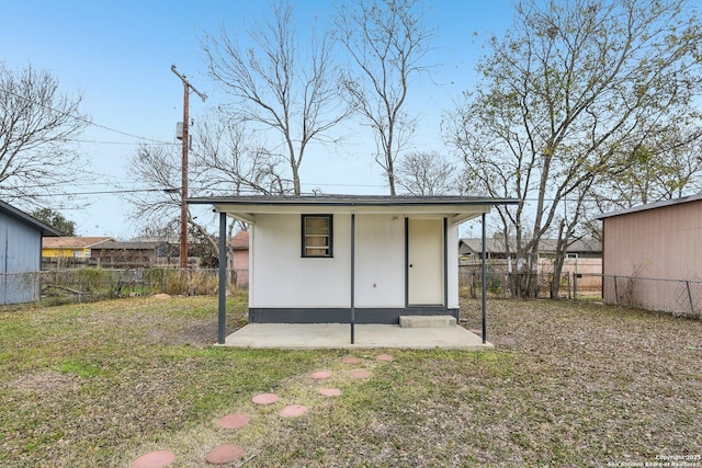 view of outbuilding with a lawn