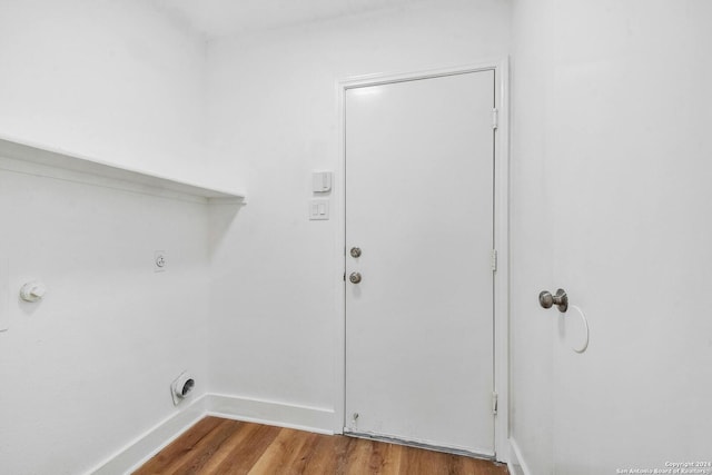 clothes washing area with hookup for an electric dryer and hardwood / wood-style floors