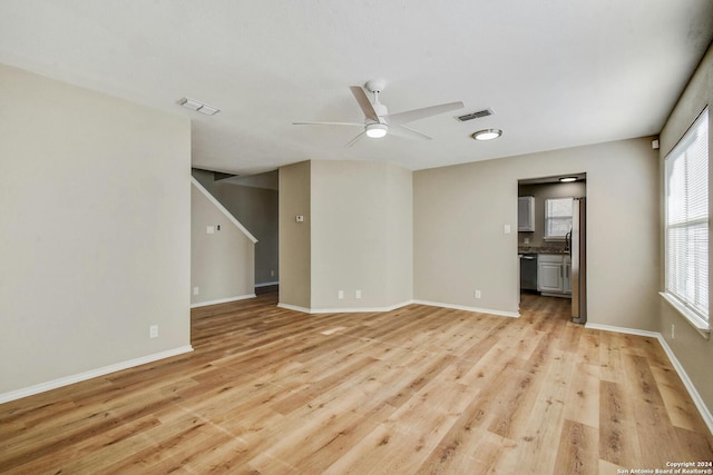 unfurnished living room featuring light wood-type flooring and ceiling fan