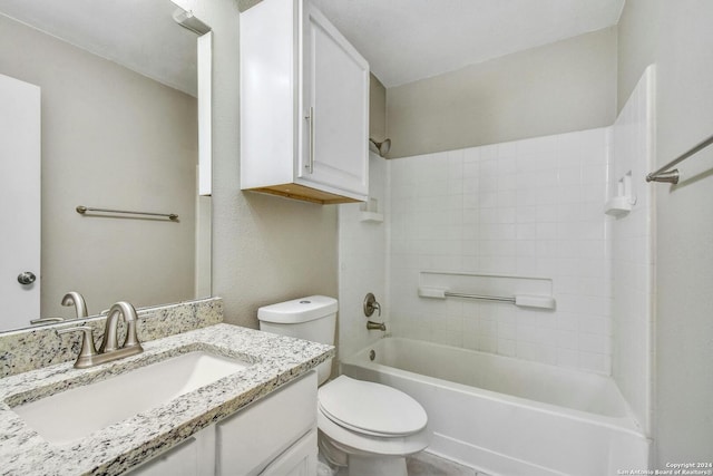 full bathroom with washtub / shower combination, vanity, and toilet