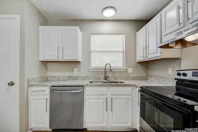 kitchen featuring sink, stainless steel appliances, white cabinets, and light stone counters