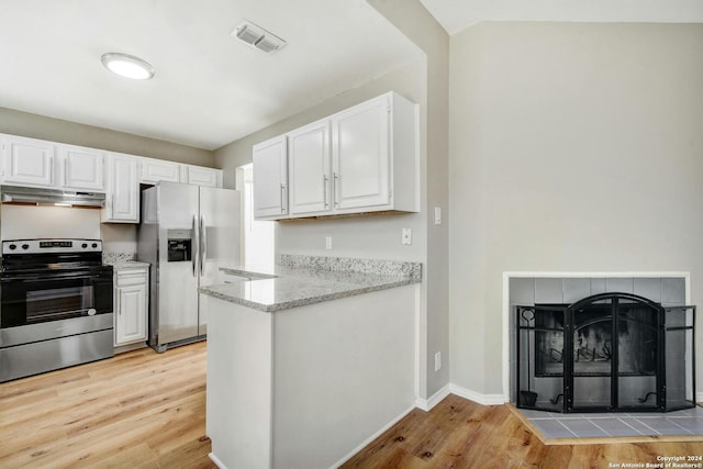 kitchen with white cabinetry, light hardwood / wood-style flooring, and appliances with stainless steel finishes