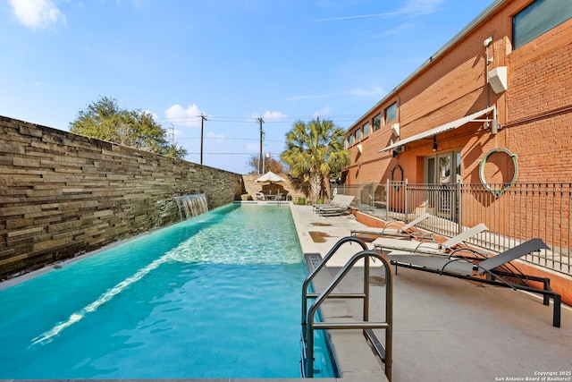 view of pool featuring a patio area and pool water feature