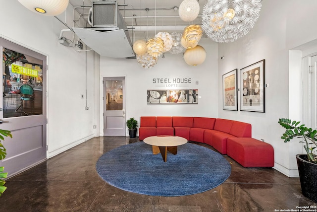 living room with a towering ceiling