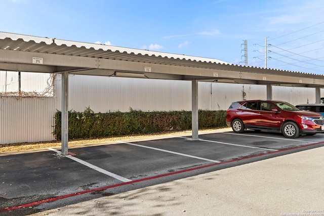 view of vehicle parking featuring a carport