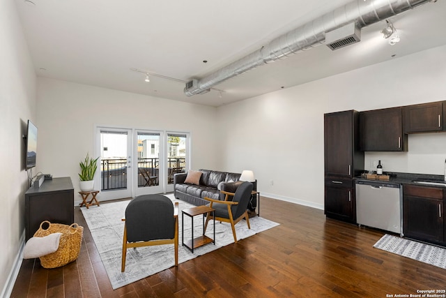 living room with sink and dark hardwood / wood-style floors