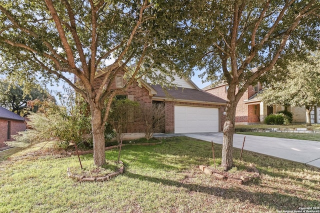 view of front of house with a front yard and a garage