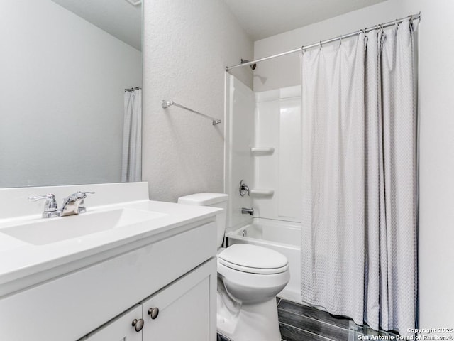 full bathroom featuring toilet, hardwood / wood-style flooring, shower / bath combination with curtain, and vanity