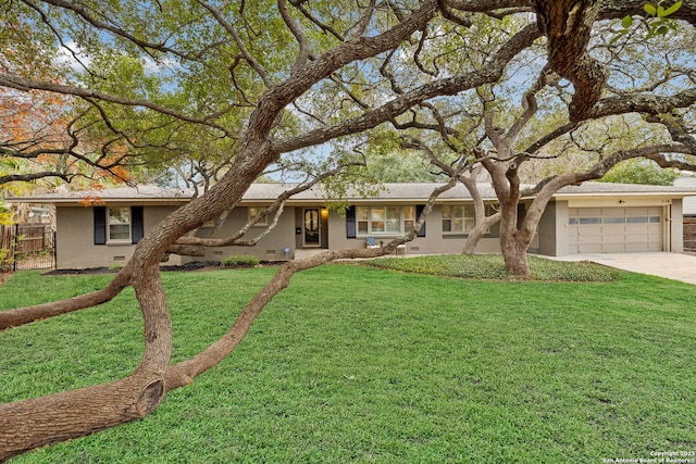 ranch-style house with a front yard and a garage