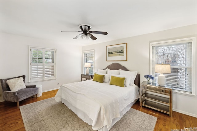 bedroom featuring ceiling fan and dark hardwood / wood-style floors