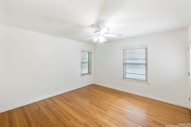 unfurnished room with ceiling fan, a wealth of natural light, and light hardwood / wood-style flooring