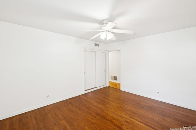 unfurnished room featuring hardwood / wood-style flooring and ceiling fan