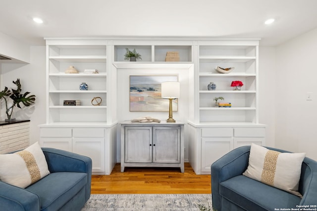 living area with light hardwood / wood-style flooring