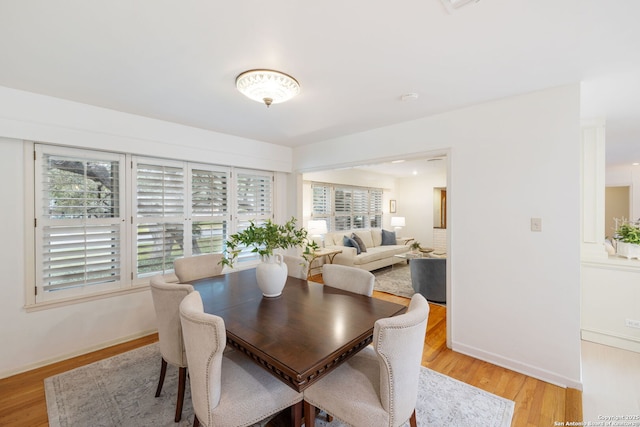 dining space featuring light hardwood / wood-style floors