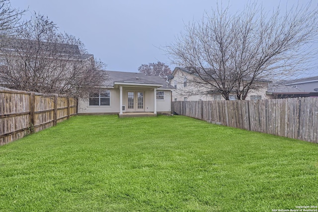 view of yard featuring french doors