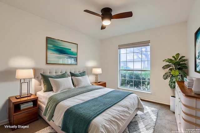 carpeted bedroom featuring ceiling fan