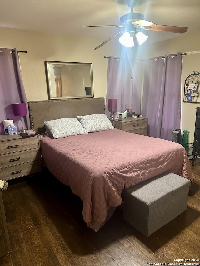 bedroom featuring dark hardwood / wood-style flooring and ceiling fan