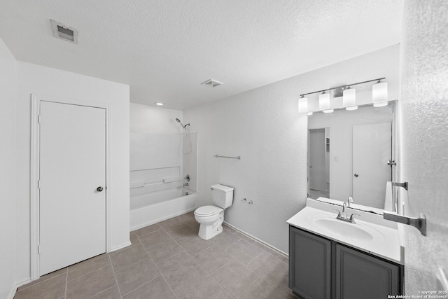 full bathroom with vanity, a textured ceiling, tile patterned flooring, toilet, and shower / washtub combination