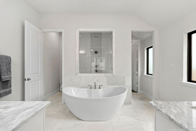 bathroom featuring separate shower and tub and vanity