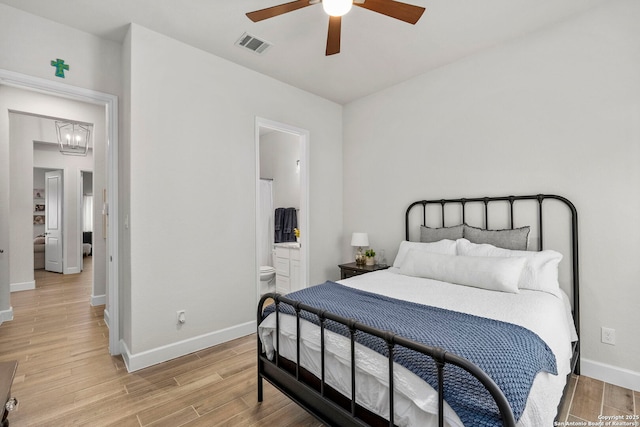 bedroom with ceiling fan and ensuite bath