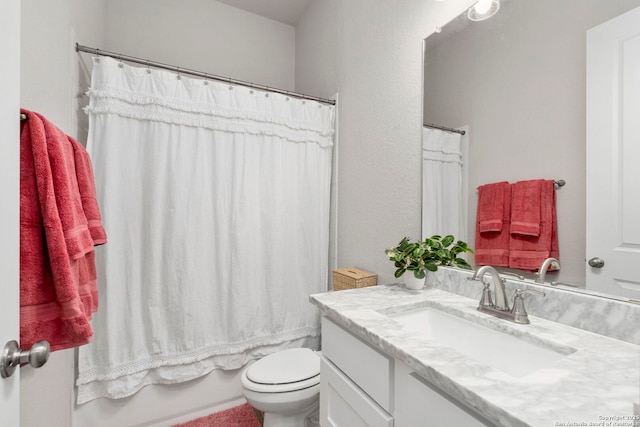 full bathroom featuring toilet, vanity, and shower / bath combo with shower curtain