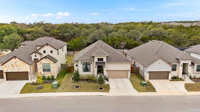 view of front of property featuring a front lawn and a garage