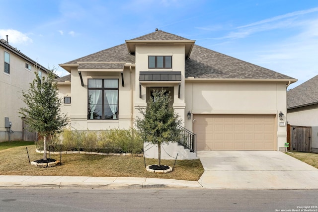 view of front of home with a front lawn and a garage