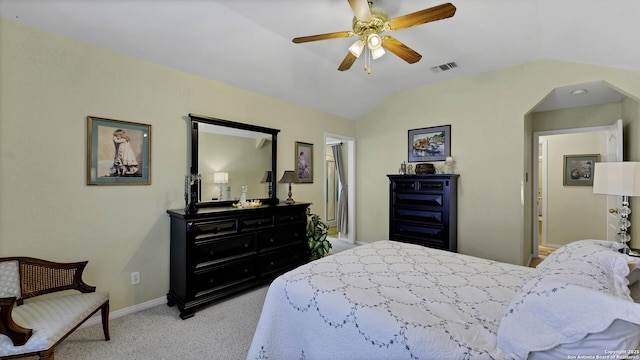 bedroom with lofted ceiling, ceiling fan, and light carpet